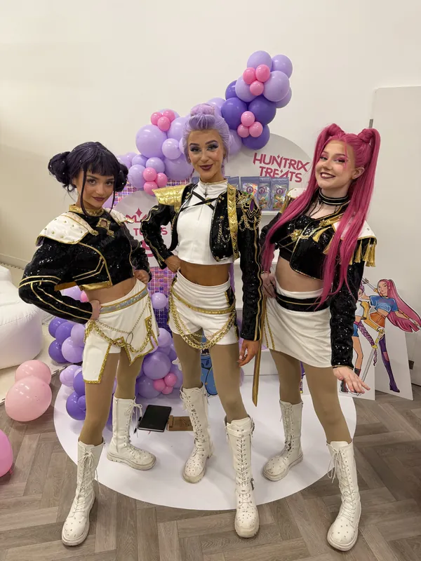 Three Demon Hunter performers posing together