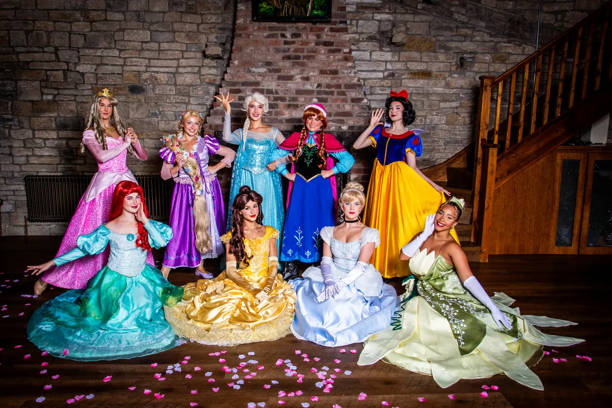 Prima Parties princess performers gathered together on a staircase