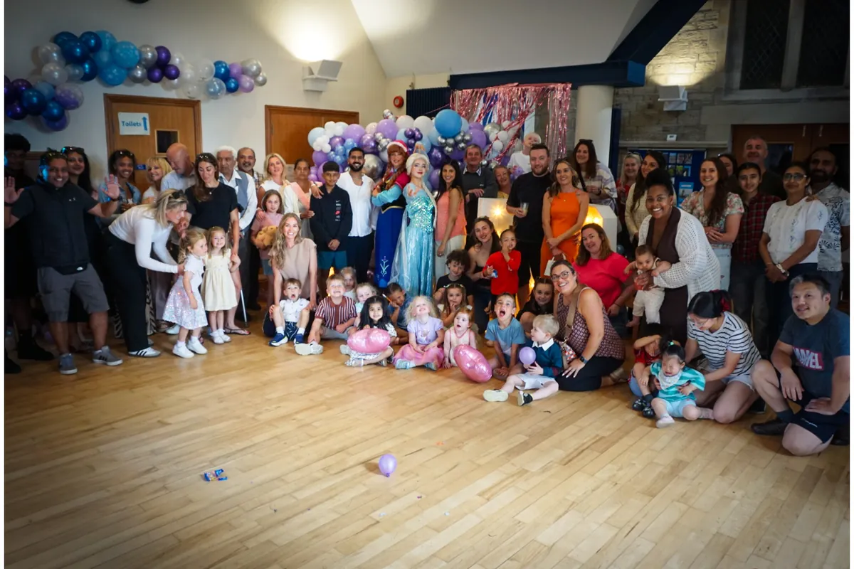 A big group photo of party guests with Prima Parties princess performers
